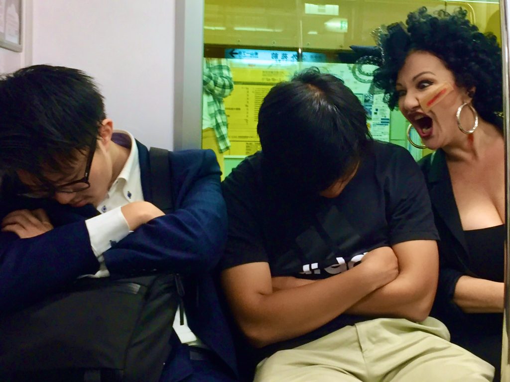 Japanese salarymen sleep on a train